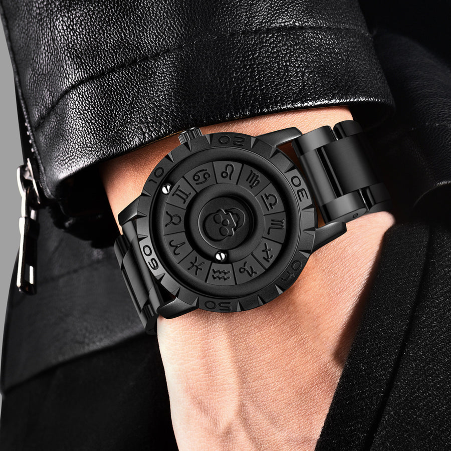 All black quartz watch with a raised skull center surrounded by zodiac symbols