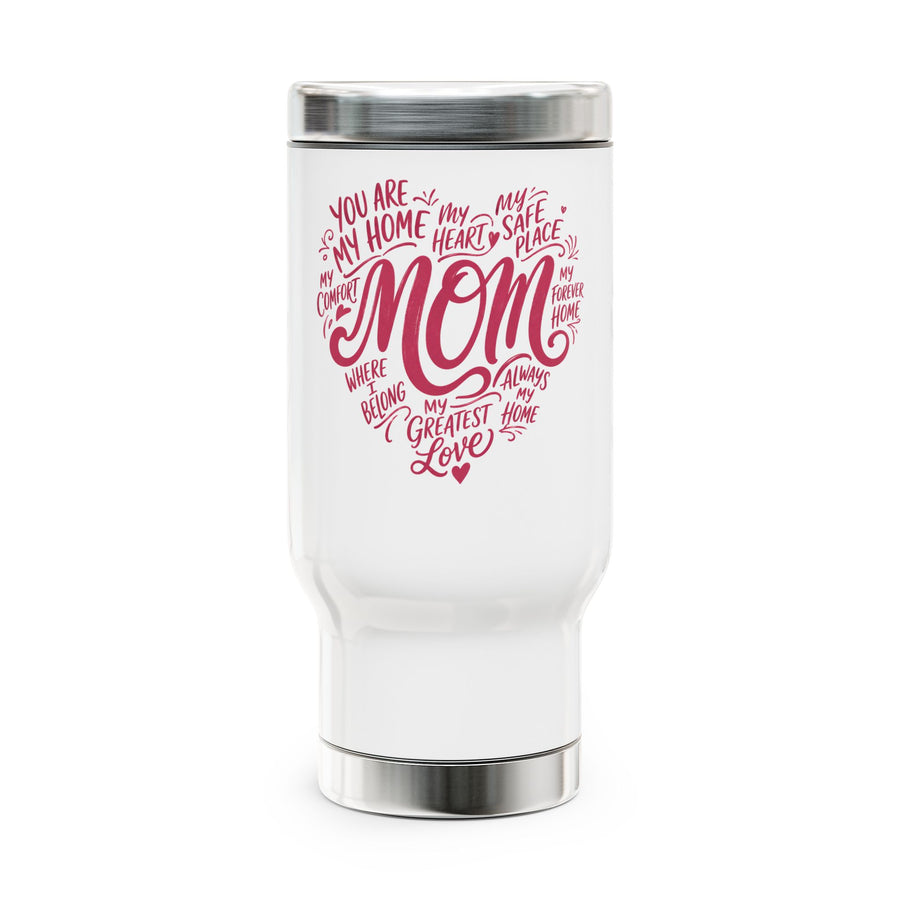 A white stainless steel travel mug with a screw-on lid, printed with a pink heart-shaped word design reading "MOM" and phrases like "my greatest love", on a desk.