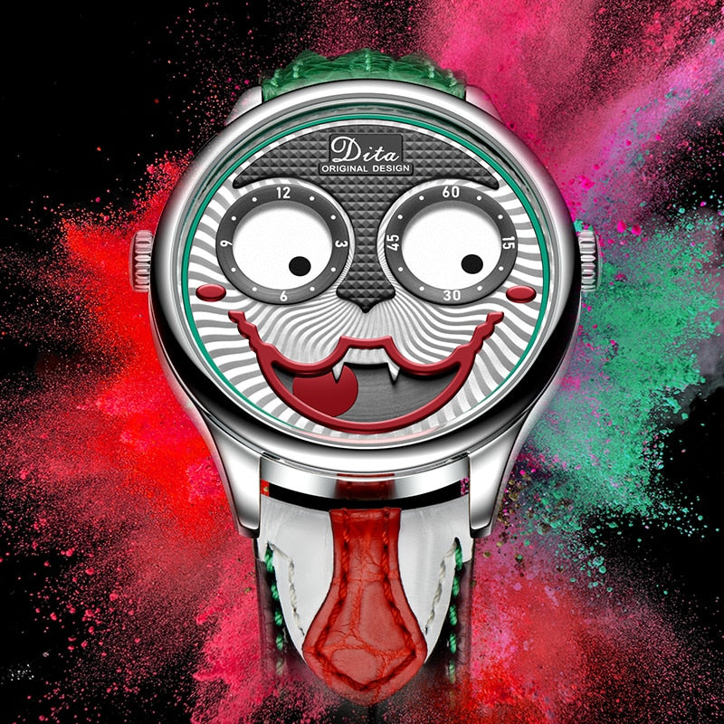 A men's quartz watch with a silver alloy case and a grinning clown-face dial with big round eye subdials, on a black leather strap with a green zigzag top section and a red tongue-shaped lower strap.