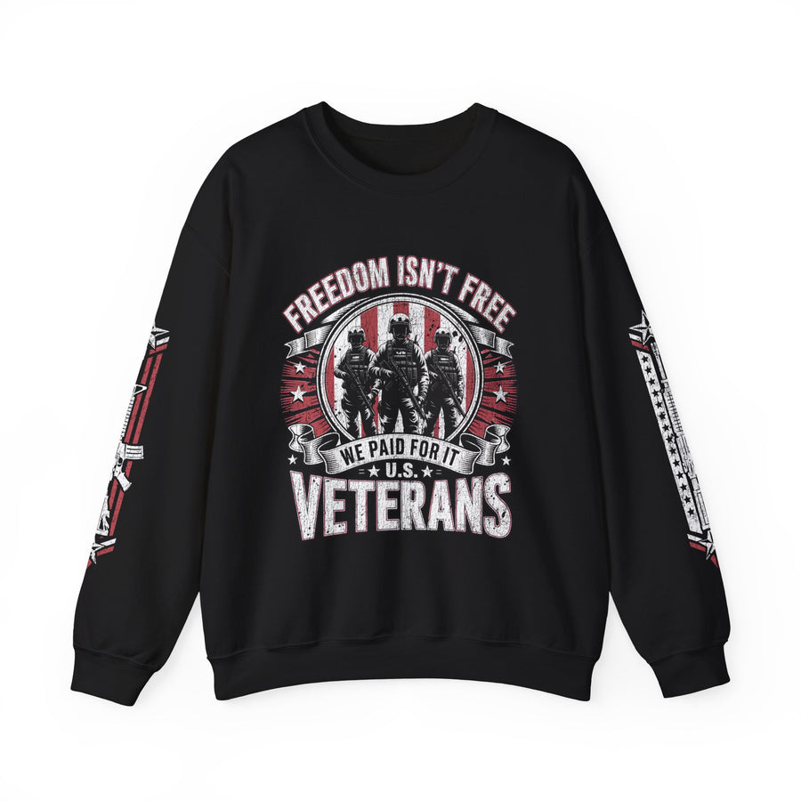 A woman wearing a black crewneck sweatshirt printed with soldier silhouettes between Freedom Isn't Free, We Paid for It and U.S. Veterans, with rifle designs on both sleeves.