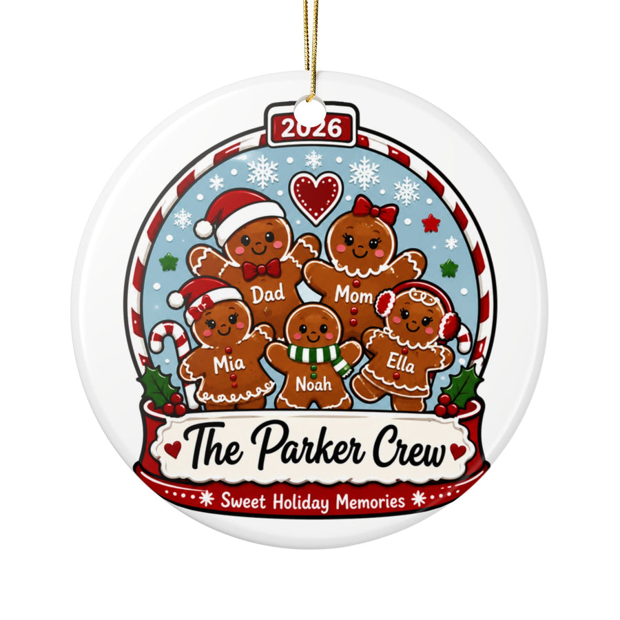 A round white ceramic Christmas ornament on a gold string, printed with a snow globe of five gingerbread people, each with a sample name, under "2026" and above "The Parker Crew, Sweet Holiday Memories".