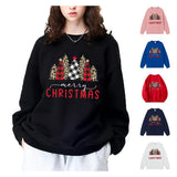 A black crewneck sweatshirt printed with leopard and buffalo-plaid Christmas trees above merry Christmas in script and red block letters, shown with smaller images of other colors.