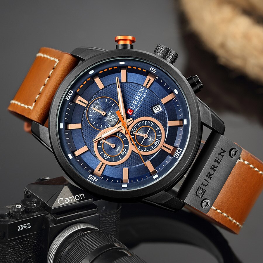 Men's black chronograph watch with leather strap and pin buckle