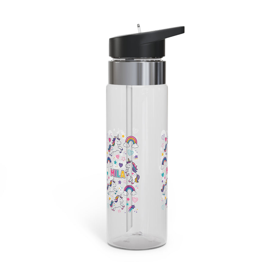 A clear Tritan water bottle with a black screw-on lid and straw, printed with colorful unicorn and rainbow graphics and a name, styled on a desk with school supplies.