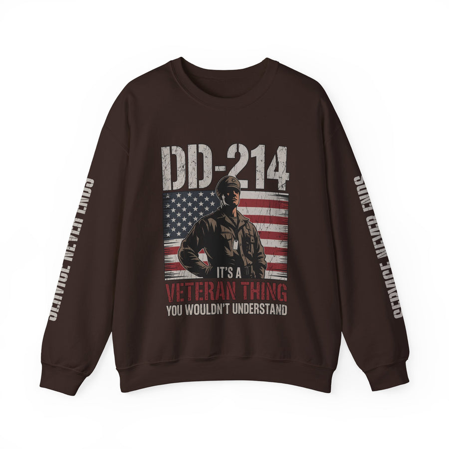 A woman wearing a dark brown crewneck sweatshirt printed with a soldier in front of an American flag under DD-214 and It's a Veteran Thing, with Service Never Ends down both sleeves.