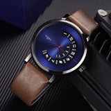 YAZOLE blue dial watch with a rotating disc time display, red hands and a brown leather strap