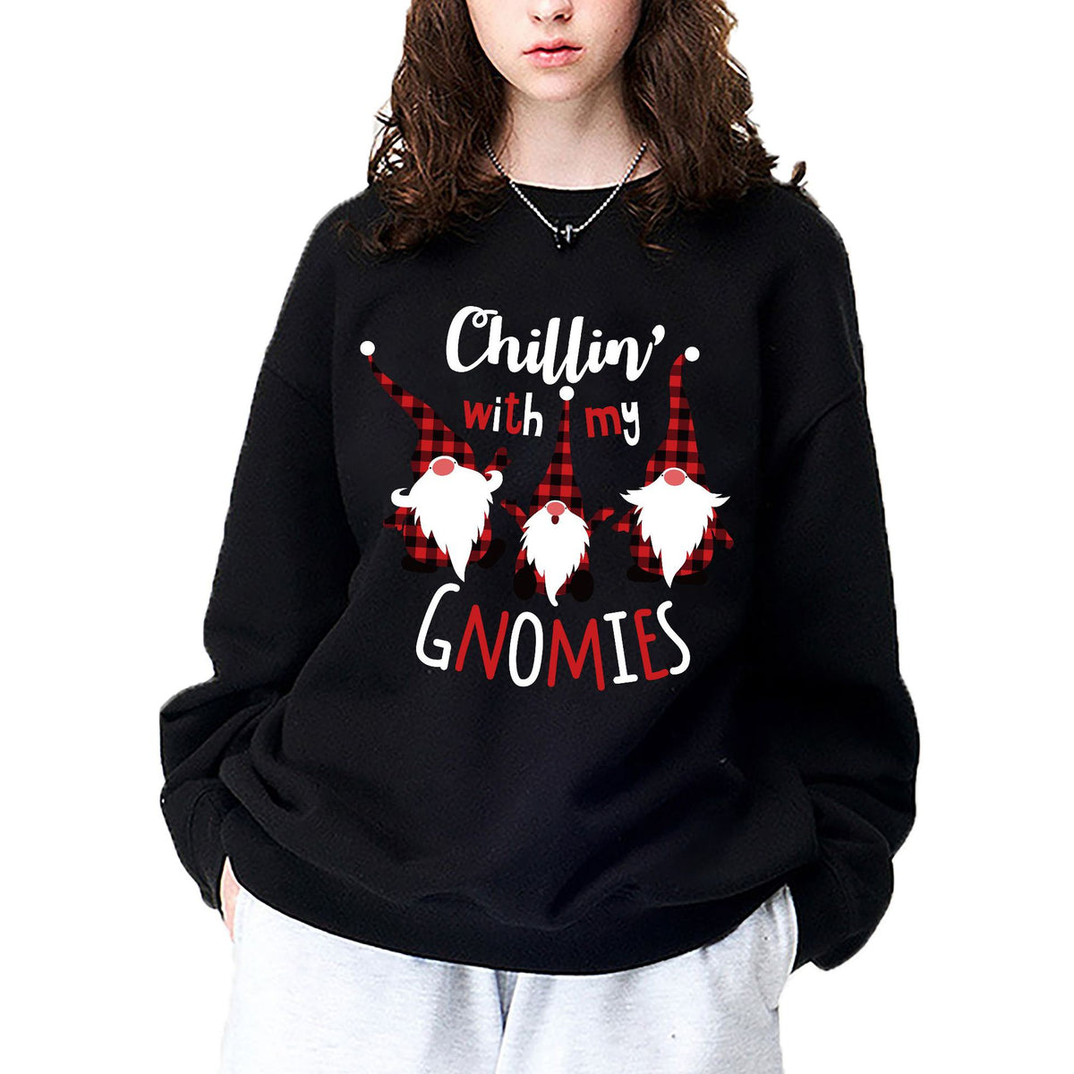 A black crewneck sweatshirt printed with three gnomes in red plaid hats and the words Chillin' with my Gnomies.