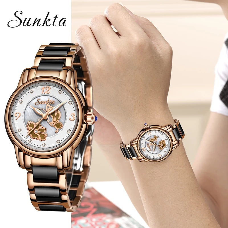 A rose gold and black ceramic link watch shown twice, once close up and once worn on a wrist, its pale dial set with two butterflies and a ring of small clear stones around the outer edge of the dial.