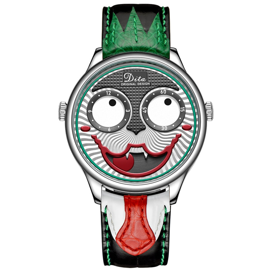 A men's quartz watch with a silver alloy case and a grinning clown-face dial with big round eye subdials, on a black leather strap with a green zigzag top section and a red tongue-shaped lower strap.