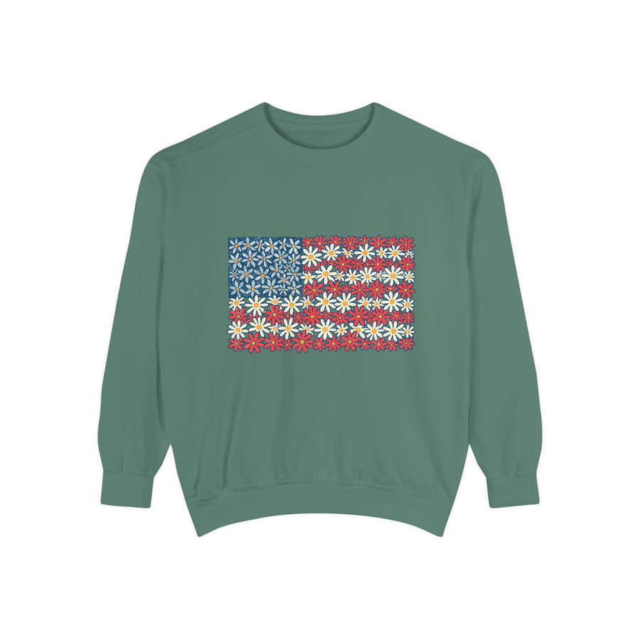 A green crewneck sweatshirt printed with an American flag made of small blue, white and red daisies.