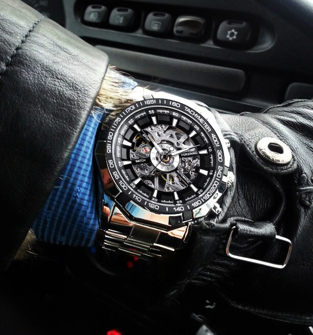 Silver skeleton automatic watch with exposed mechanical dial, stainless steel bracelet