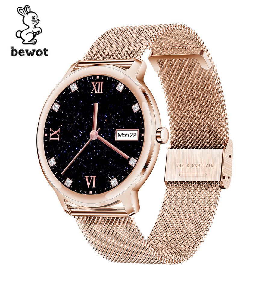 Rose gold smartwatch with a starry night dial, crystal hour markers, and a mesh strap