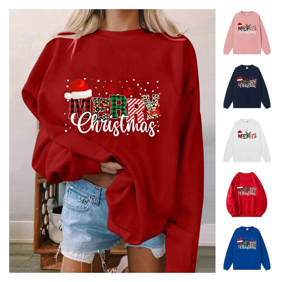 A red crewneck sweatshirt printed with Merry Christmas in patterned lettering topped with a Santa hat, shown with smaller images of other colors.