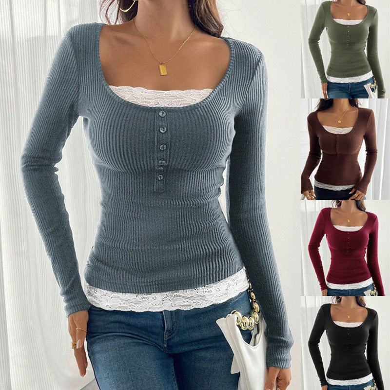 A woman wearing a slate blue ribbed long sleeved top edged with white lace at the square neckline and hem, with a short row of dark buttons down the centre chest, her hands resting together below.