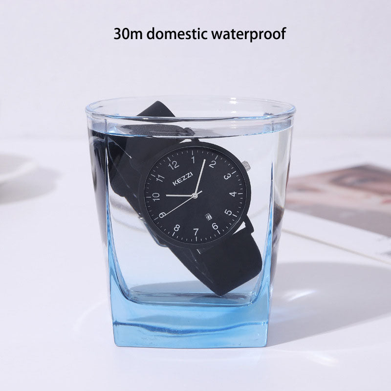 All-black minimalist watch with a round dial, shown worn on a wrist