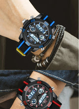 Black and blue analog-digital watch with LED display windows, worn on wrist with beaded bracelet